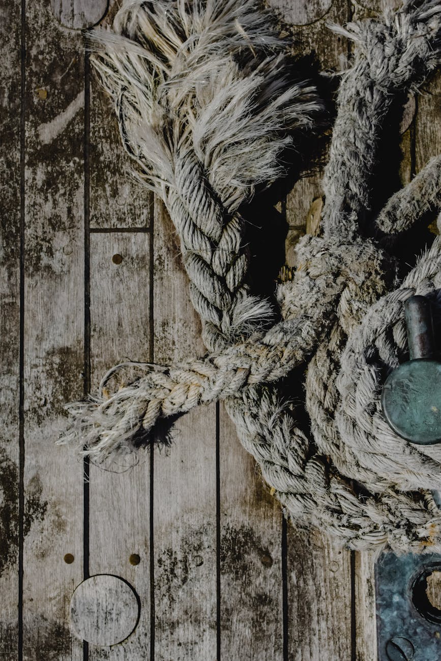 close up shot of a rope on a wooden surface